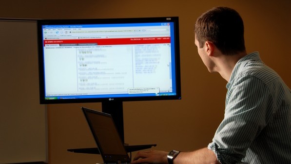 Student takes a class via computer. PHOTO BY ROGER WINSTEAD