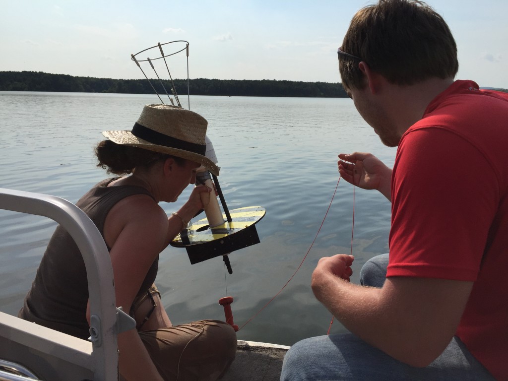 NCSU undergraduate researcher, Jeremy Smithheart, works with physical limnologist Dr. Robyn Smyth from Bard College to measure vertical diffusivity profiles in upper Jordan Lake.