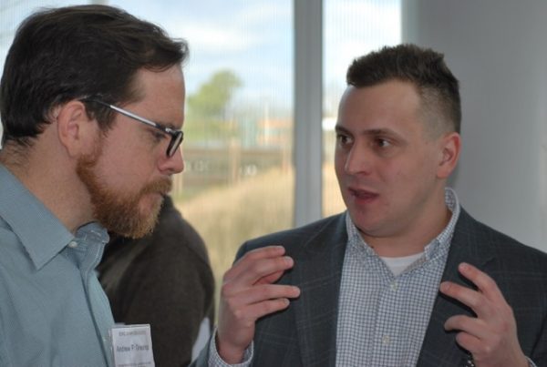 PhD student Dominic Libera, right, explains his research to Dr. Andy Grieshop.