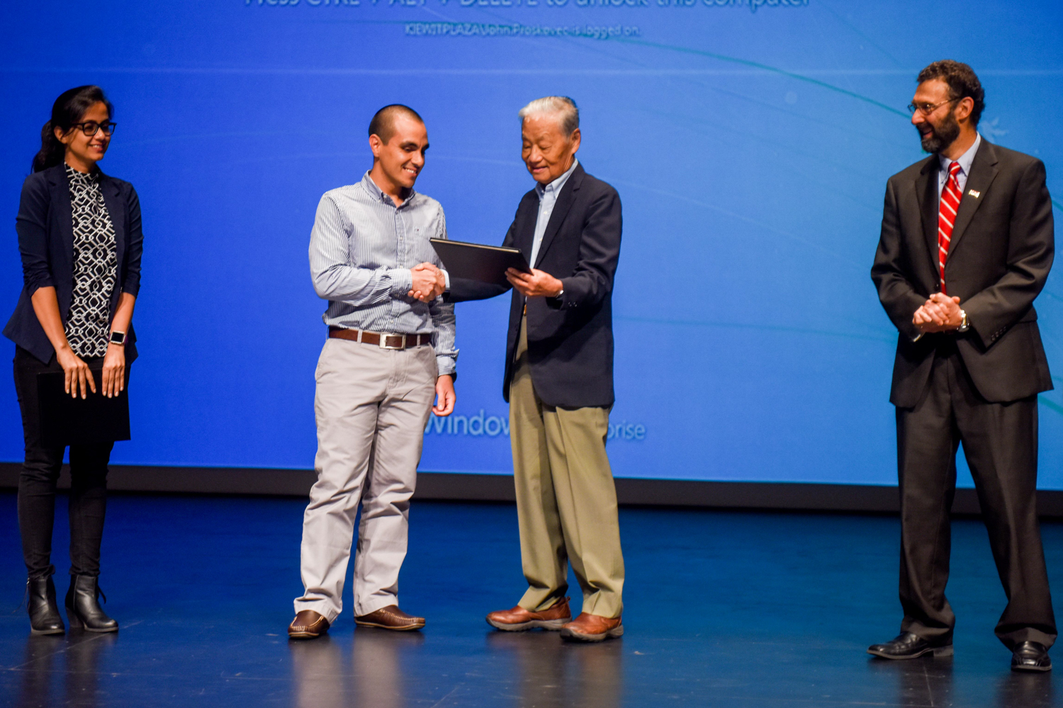 This year during program intermission, the Zia Committee presented Graduate Awards to Masters students in Structural Engineering. Pictured here from left to right are award recipients Payel Chatterjee and Diego Aguirre with Dr. Paul Zia and Dr. Morton Barlaz. Award winner Danny Smyl was unable to attend.