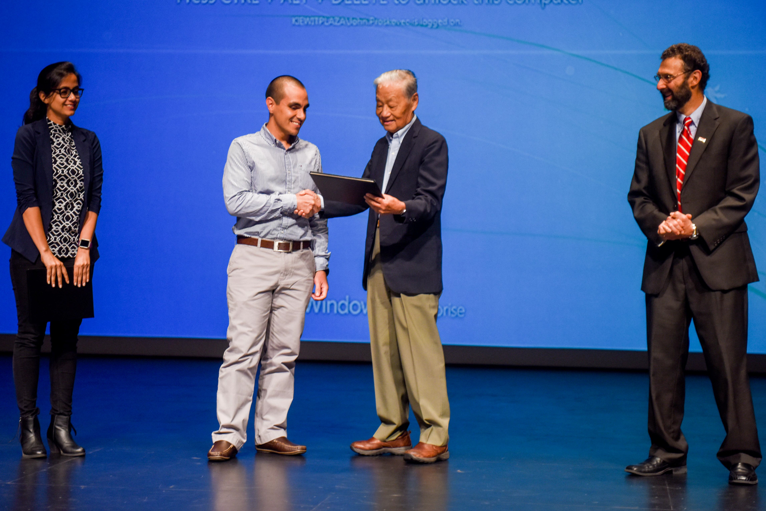 This year during program intermission, the Zia Committee presented Graduate Awards to Masters students in Structural Engineering.  Pictured here from left to right are award recipients Payel Chatterjee and Diego Aguirre with Dr. Paul Zia and Dr. Morton Barlaz.   Award winner Danny Smyl was unable to attend.